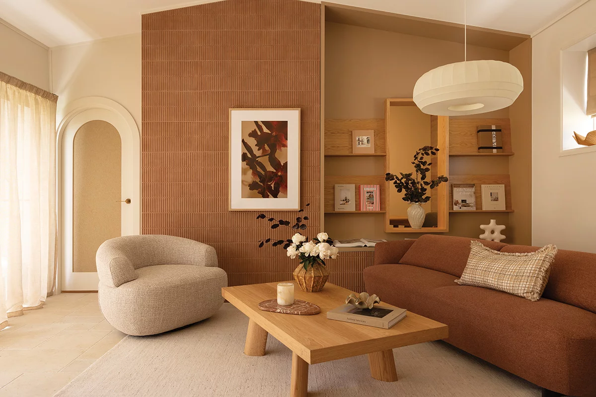 Quiet studio interior with neutral linen seating and warm lamps